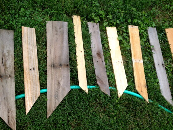 Original art created by Laurie Smithwick (and family) for Yard Art Day in Charlotte, NC. The piece is a riff on the picket fence that doesn't actually keep anyone out, called "What's (Y)Ours is..."