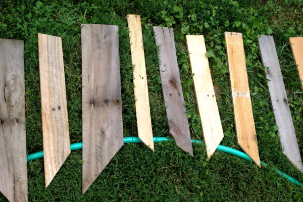 Original art created by Laurie Smithwick (and family) for Yard Art Day in Charlotte, NC. The piece is a riff on the picket fence that doesn't actually keep anyone out, called "What's (Y)Ours is..."