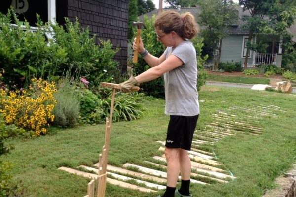 Original art created by Laurie Smithwick (and family) for Yard Art Day in Charlotte, NC. The piece is a riff on the picket fence that doesn't actually keep anyone out, called "What's (Y)Ours is..."