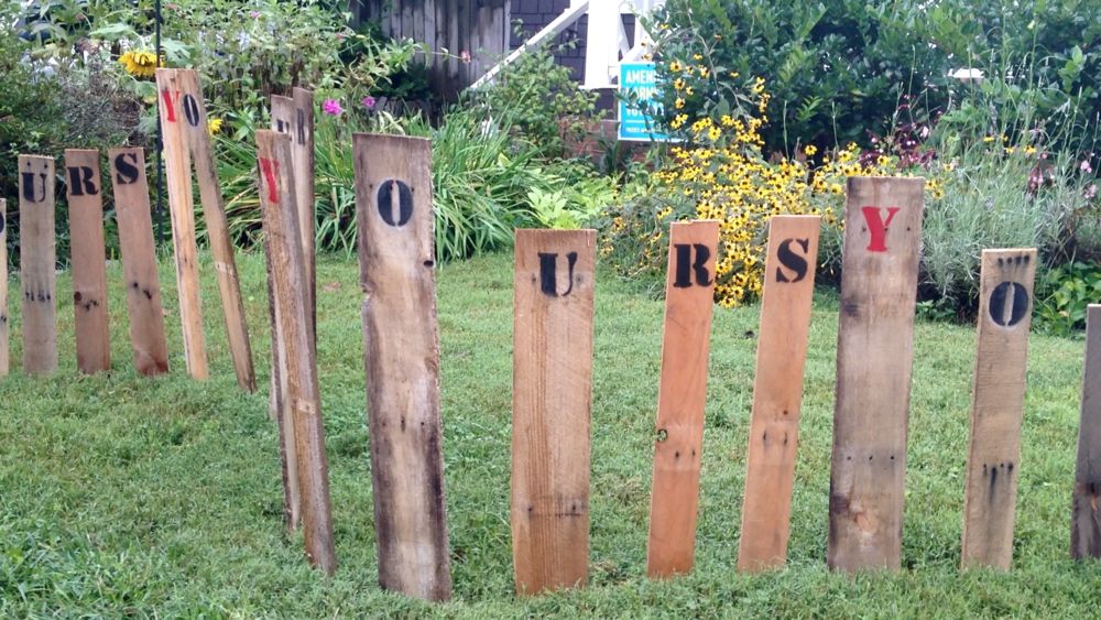 Original art created by Laurie Smithwick (and family) for Yard Art Day in Charlotte, NC. The piece is a riff on the picket fence that doesn't actually keep anyone out, called "What's (Y)Ours is..."