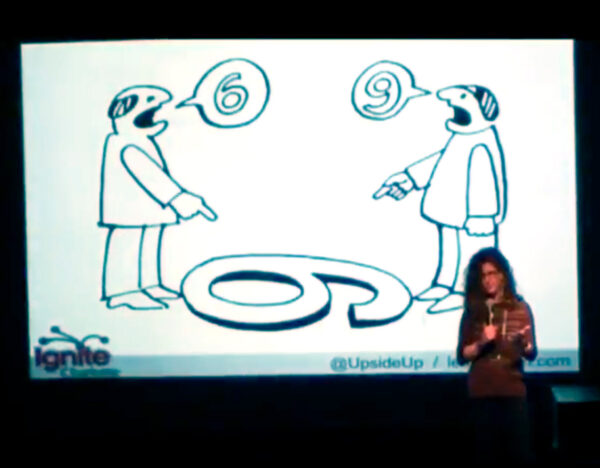 Laurie Smithwick on stage at Ignite Charlotte delivering her talk, How to Get Just About Anyone to Do Just About Anything.
