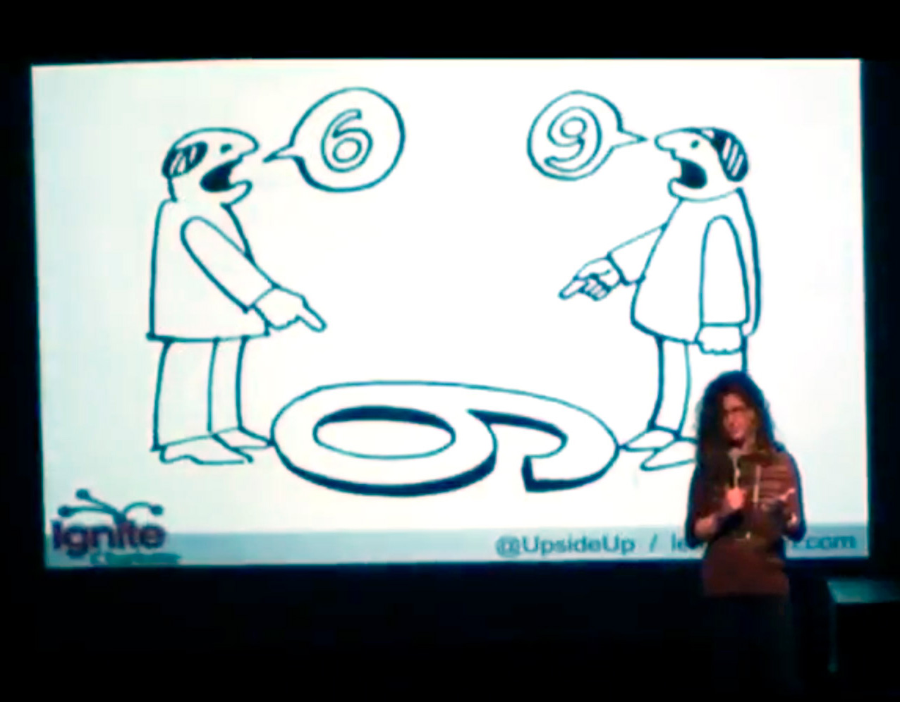 Laurie Smithwick on stage at Ignite Charlotte delivering her talk, How to Get Just About Anyone to Do Just About Anything.